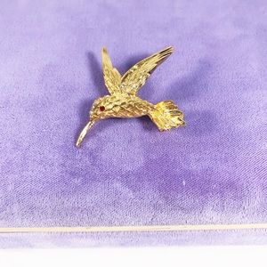 Goldtone bling humming bird brooch,